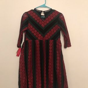 Embroidered jewel tone dress.